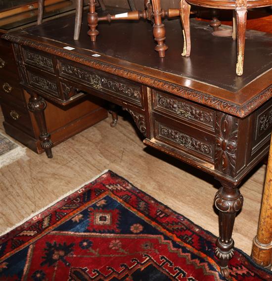 Carved oak writing table